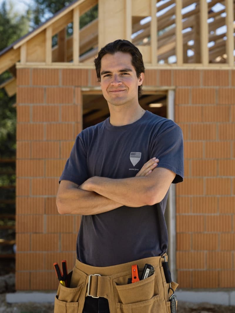 Sam Hartwood, site lead, in his thirties, photographed on site